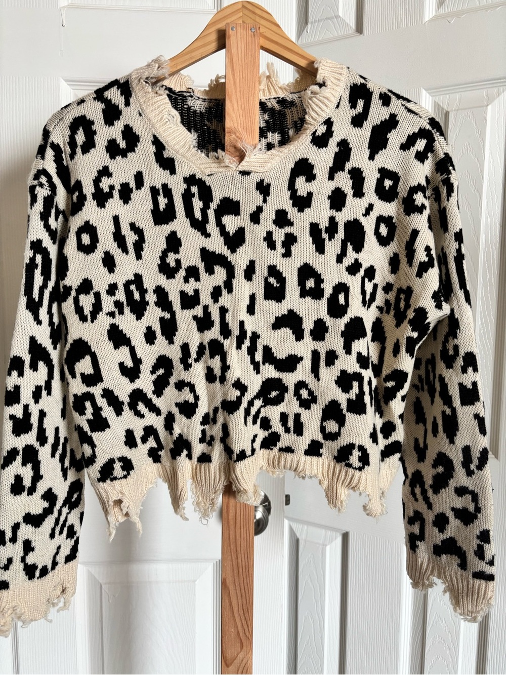 Belle Du Jour Cream and Black Leopard Distressed Crewneck Sweater